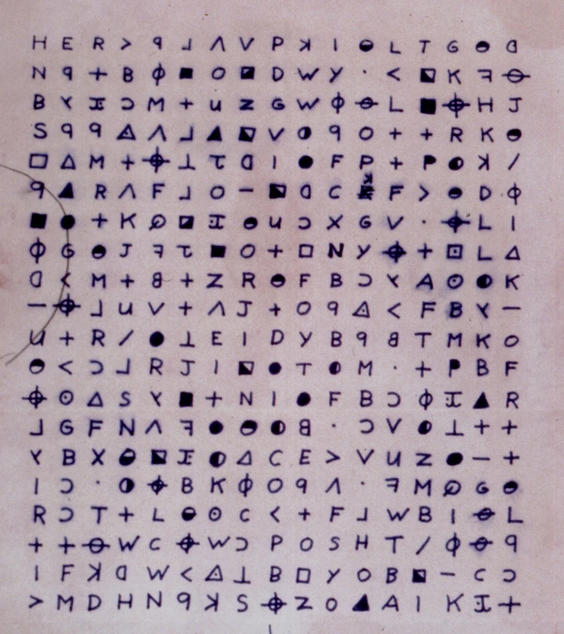 The Zodiac Killer’s 340-character cipher: a dense grid of hand-drawn letters, circles, triangles, and crosshair symbols